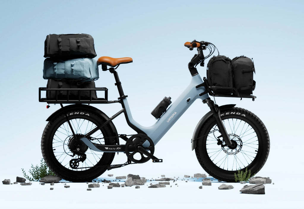 A Glacier Blue Lightweight Fat Tire eBike with a step - through frame, ideal for cargo and commuting.