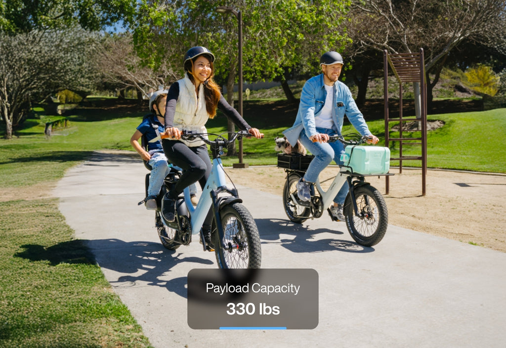 People riding Lightweight Fat Tire eBikes, demonstrating a payload capacity of 330 lbs.
