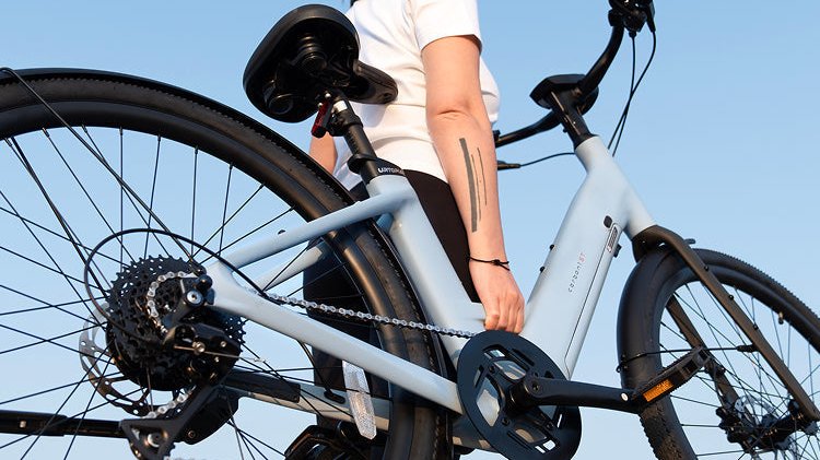 Folding e-bike vs full-size e-bike comparison showing portability